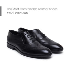 Hayes London Monarch Wingtip Brogues in black perforated genuine leather featured in a comfort-focused promotional banner, showcasing classic wingtip detailing, decorative brogue perforations, premium craftsmanship, and all-day formal comfort